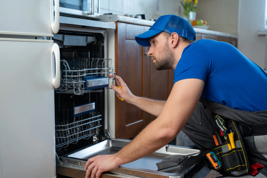 worker-repairing-dishwasher-in-kitchen-springfield-va